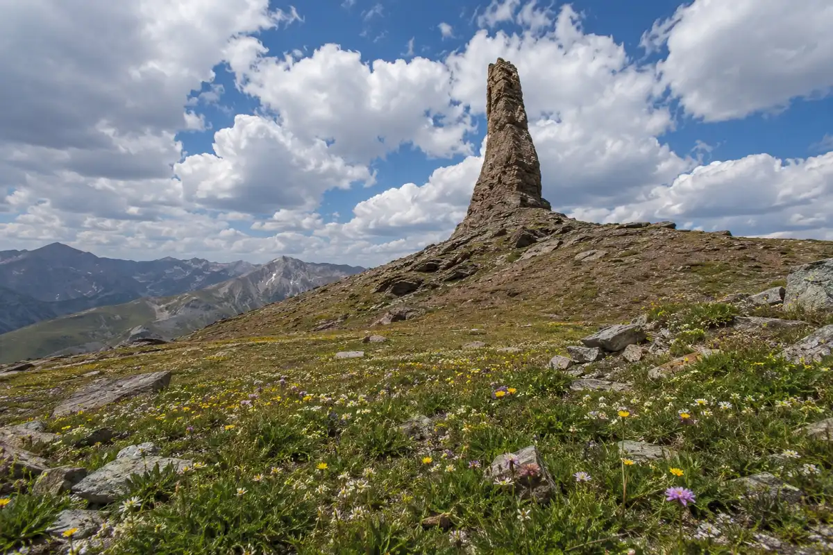 Distinctive rock spire known as Devils Thumb rising above alpine tundra near the Continental Divide