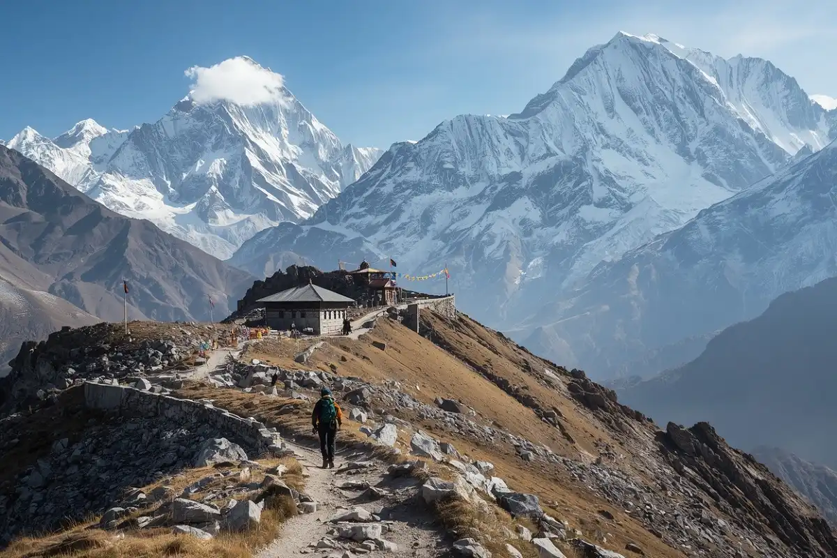 Trekkers hiking the Annapurna Circuit beneath snow covered Himalayan peaks